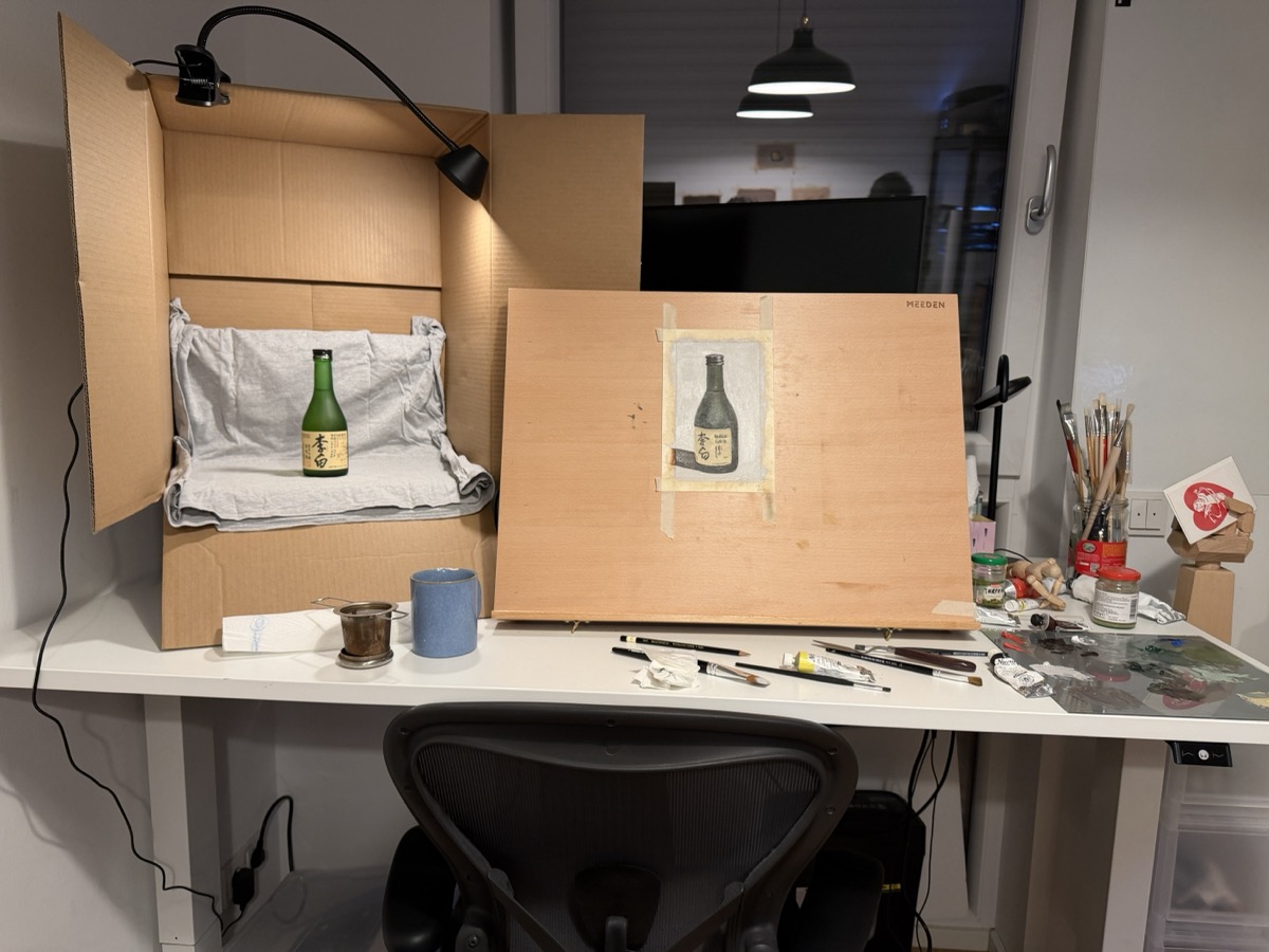 painting setup with sake bottle and its painting